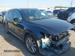 2020 Mazda CX-9 Grand Touring z VIN JM3TCADY0L0422548, wystawiony jako IAAI lot #41839601 z przebiegiem 116 952 mil mil oraz . Historia ofert i sprzedaży dostępna na DreamBid. Obrazek 1.