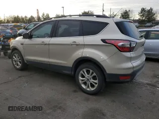 2018 Ford Escape SE z VIN 1FMCU9GD7JUA34635, wystawiony jako Copart lot #48379395 z przebiegiem 123 832 mil mil oraz Szkoda całkowita • Salvage title. Historia ofert i sprzedaży dostępna na DreamBid. Obrazek 2.