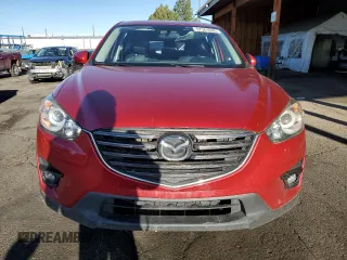 2016 Mazda CX-5 Grand Touring z VIN JM3KE4DY9G0753691, wystawiony jako Copart lot #57361645 z przebiegiem 90 733 mil mil oraz Szkoda całkowita • Salvage title. Historia ofert i sprzedaży dostępna na DreamBid. Obrazek 5.