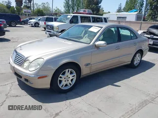 2003 Mercedes-Benz E-Class 3.2L with VIN WDBUF65JX3A236768, listed as a IAAI auction lot 42094824 with 251,896 mi miles. Bid and sale history available at carsss.com. Image 2.