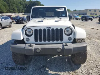 2015 Jeep Wrangler Unlimited Sahara with VIN 1C4BJWEG3FL584920, listed as a Copart auction lot 61843525 with 62,876 mi miles and Salvage title. Bid and sale history available at DreamBid. Image 5.