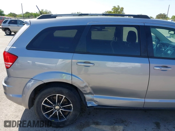 2017 Dodge Journey SE z VIN 3C4PDCAB1HT573511, wystawiony jako IAAI lot #41984865 z przebiegiem 128 721 mil mil oraz . Historia ofert i sprzedaży dostępna na DreamBid. Obrazek 6.