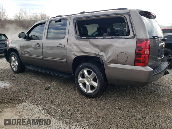 2013 Chevrolet Suburban LT with VIN 1GNSKJE7XDR341736, listed as a Copart auction lot 48781145 with 157,871 mi miles and Salvage Title. Bid and sale history available at DreamBid. Image 2.