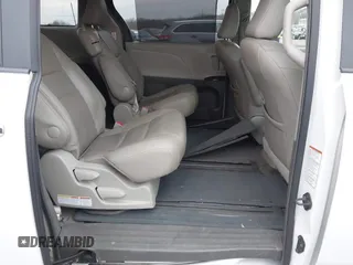 2015 Toyota Sienna XLE with VIN 5TDYK3DC9FS595827, listed as a IAAI auction lot 41014820 with 119,143 mi miles. Bid and sale history available at carsss.com. Image 8.