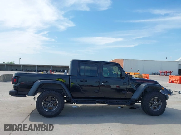 2021 Jeep Gladiator Rubicon z VIN 1C6JJTBG6ML535939, wystawiony jako IAAI lot #42260764 z przebiegiem 114 060 mil mil oraz . Historia ofert i sprzedaży dostępna na DreamBid. Obrazek 13.