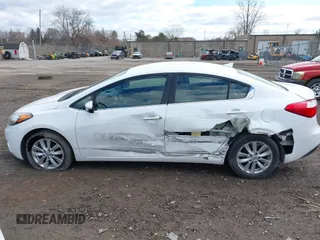 2014 Kia Forte EX with VIN KNAFX4A8XE5050378, listed as a IAAI auction lot 41923798 with 104,712 mi miles. Bid and sale history available at carsss.com. Image 14.