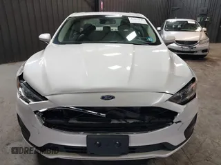 2020 Ford Fusion SE z VIN 3FA6P0LU8LR142370, wystawiony jako IAAI lot #42457342 z przebiegiem 53 808 mil mil oraz . Historia ofert i sprzedaży dostępna na DreamBid. Obrazek 6.