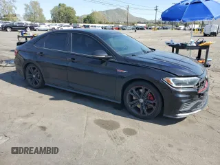 2019 Volkswagen Jetta GLI S with VIN 3VW5T7BU9KM143452, listed as a Copart auction lot 52015965 with 115,652 mi miles and Salvage title. Bid and sale history available at DreamBid. Image 4.