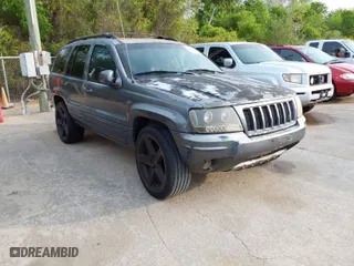 2004 Jeep Grand Cherokee Laredo with VIN 1J4GX48S14C218695, listed as a IAAI auction lot 41933611 with 158,290 mi miles. Bid and sale history available at carsss.com. Image 1.