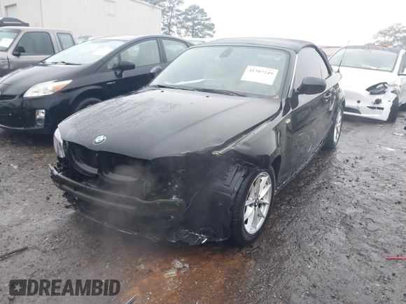 2011 BMW 1 Series 128i with VIN WBAUL7C52BVM79176, listed as a IAAI auction lot 41387249 with 99,145 mi miles and . Bid and sale history available at carsss.com. Image 19.