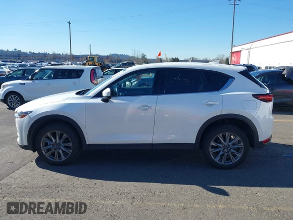 2021 Mazda CX-5 Grand Touring with VIN JM3KFBDM6M0483135, listed as a IAAI auction lot 41590430 with 33,466 mi miles. Bid and sale history available at carsss.com. Image 14.