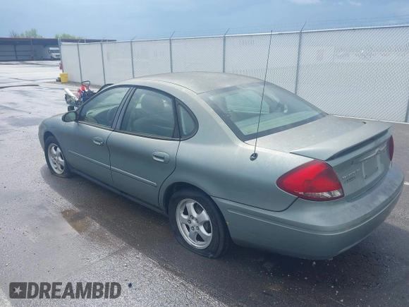 2005 Ford Taurus SE with VIN 1FAFP53U55A209369, listed as a IAAI auction lot 42144800 with 152,446 mi miles. Bid and sale history available at carsss.com. Image 3.