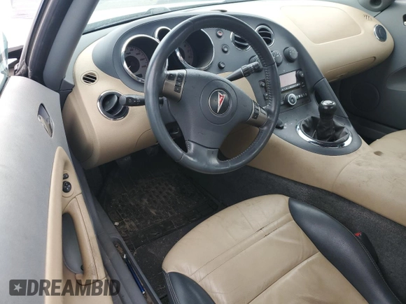2006 Pontiac Solstice z VIN 1G2MB33B56Y106095, wystawiony jako Copart lot #52068765 z przebiegiem Nie podano mil oraz Szkoda całkowita • Salvage title. Historia ofert i sprzedaży dostępna na DreamBid. Obrazek 8.