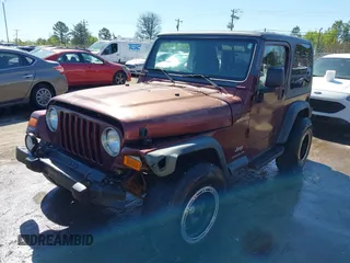 2003 Jeep Wrangler Sport with VIN 1J4FA49S33P345192, listed as a IAAI auction lot 41801344 with 196,472 mi miles. Bid and sale history available at carsss.com. Image 2.