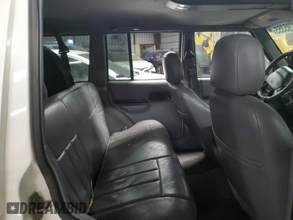 1997 Jeep Cherokee Country with VIN 1J4FJ78S0VL587323, listed as a Copart auction lot 89295355 with 205,432 mi miles and Salvage Title. Bid and sale history available at carsss.com. Image 10.