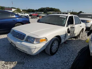 2004 Ford Crown Victoria LX z VIN 2FDFP74W34X164453, wystawiony jako Copart lot #75922204 z przebiegiem 103 546 mil mil oraz Szkody całkowita. Historia ofert i sprzedaży dostępna na DreamBid. Obrazek 1.