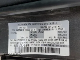 2018 Mazda 3 Touring z VIN 3MZBN1L38JM219466, wystawiony jako Copart lot #56766025 z przebiegiem 124 775 mil mil oraz Szkoda całkowita • Salvage title. Historia ofert i sprzedaży dostępna na DreamBid. Obrazek 12.