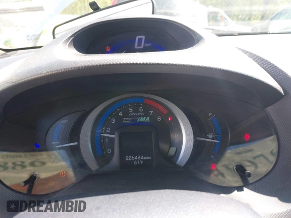 2010 Honda Insight EX with VIN JHMZE2H75AS013109, listed as a IAAI auction lot 41976886 with 226,434 mi miles and . Bid and sale history available at DreamBid. Image 7.