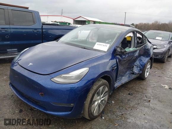 2023 Tesla Model Y Long Range with VIN 7SAYGDEE7PF673988, listed as a IAAI auction lot 41057651 with 29,683 mi miles and . Bid and sale history available at DreamBid. Image 2.
