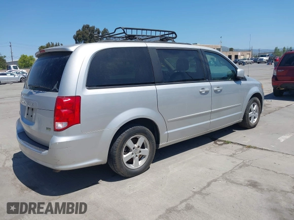 2012 Dodge Grand Caravan SXT with VIN 2C4RDGCG2CR223891, listed as a IAAI auction lot 42189650 with 119,669 mi miles and . Bid and sale history available at DreamBid. Image 4.
