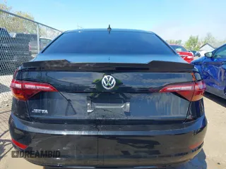 2019 Volkswagen Jetta S z VIN 3VWC57BU7KM188438, wystawiony jako IAAI lot #42183578 z przebiegiem 77 297 mil mil oraz . Historia ofert i sprzedaży dostępna na DreamBid. Obrazek 14.