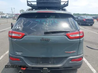 2015 Jeep Cherokee Trailhawk with VIN 1C4PJMBB0FW528421, listed as a IAAI auction lot 42591132 with 166,425 mi miles and . Bid and sale history available at DreamBid. Image 16.