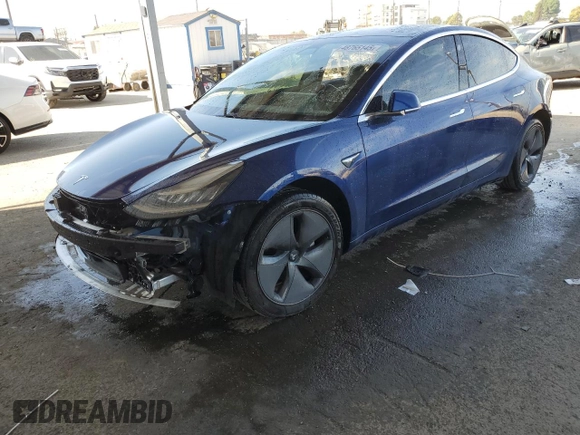 2020 Tesla Model 3 Standard Range Plus with VIN 5YJ3E1EA7LF705907, listed as a Copart auction lot 48765145 with 104,479 mi miles and Salvage Title. Bid and sale history available at DreamBid. Image 1.