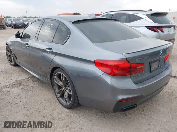 2018 BMW 5 Series M550i xDrive with VIN WBAJB9C55JB035694, listed as a IAAI auction lot 42122730 with 61,561 mi miles and . Bid and sale history available at DreamBid. Image 3.