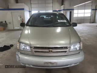2000 Toyota Sienna LE z VIN 4T3ZF13C6YU210501, wystawiony jako Copart lot #56510955 z przebiegiem 253 950 mil mil oraz Szkody całkowita. Historia ofert i sprzedaży dostępna na DreamBid. Obrazek 5.
