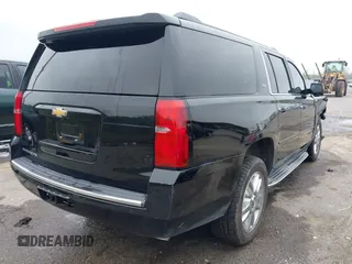 2015 Chevrolet Suburban LTZ with VIN 1GNSCKKC6FR271675, listed as a IAAI auction lot 41915036 with 150,917 mi miles. Bid and sale history available at carsss.com. Image 4.