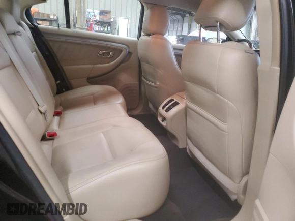 2014 Ford Taurus SEL z VIN 1FAHP2E80EG128686, wystawiony jako Copart lot #57158255 z przebiegiem 69 529 mil mil oraz Szkoda całkowita • Salvage title. Historia ofert i sprzedaży dostępna na DreamBid. Obrazek 10.