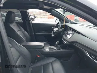 2021 Cadillac XT4 AWD Sport with VIN 1GYFZFR49MF065225, listed as a IAAI auction lot 41191994 with 58,095 mi miles and . Bid and sale history available at DreamBid. Image 5.