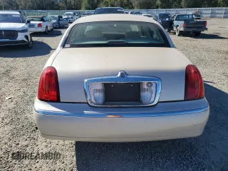 2001 Lincoln Town Car Cartier z VIN 1LNHM83W31Y671814, wystawiony jako Copart lot #77169664 z przebiegiem Nie podano mil oraz Szkoda całkowita • Salvage title. Historia ofert i sprzedaży dostępna na DreamBid. Obrazek 6.