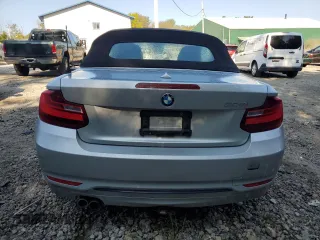 2016 BMW 2 Series 228i with VIN WBA1K9C52GV321963, listed as a Copart auction lot 71393424 with 118,029 mi miles and Salvage Title. Bid and sale history available at carsss.com. Image 6.
