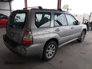 2007 Subaru Forester X w/Premium Pkg with VIN JF1SG65627H710720, listed as a IAAI auction lot 41489413 with 147,158 mi miles. Bid and sale history available at carsss.com. Image 4.