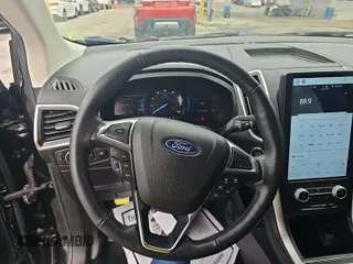 2022 Ford Edge SEL z VIN 2FMPK4J94NBA63181, wystawiony jako IAAI lot #42468224 z przebiegiem 31 072 mil mil oraz . Historia ofert i sprzedaży dostępna na DreamBid. Obrazek 1.