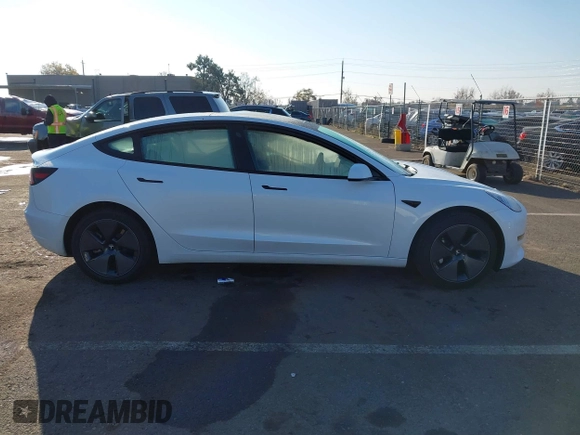 2023 Tesla Model 3 with VIN 5YJ3E1EA2PF582331, listed as a IAAI auction lot 41043858 with 33,601 mi miles and . Bid and sale history available at DreamBid. Image 13.