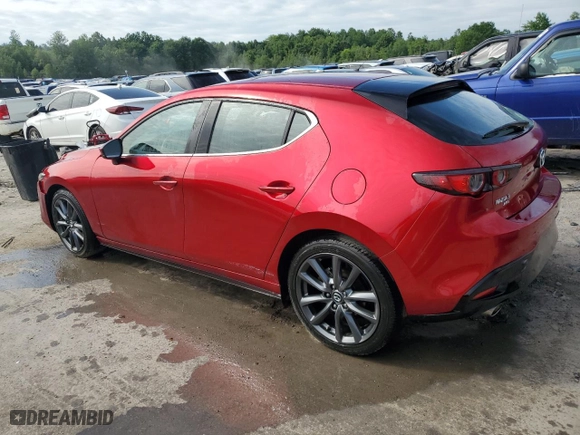 2019 Mazda Mazda3 Hatchback with VIN JM1BPBJM9K1140773, listed as a Copart auction lot 57002824 with 76,804 mi miles and Salvage Title. Bid and sale history available at carsss.com. Image 2.