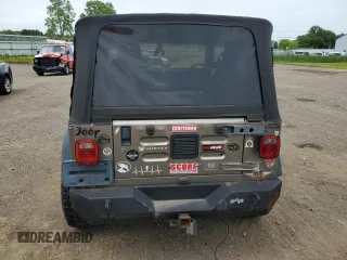 2004 Jeep Wrangler Rubicon z VIN 1J4FA69S24P713388, wystawiony jako Copart lot #61196515 z przebiegiem 155 092 mil mil oraz Czysty tytuł • Clean title. Historia ofert i sprzedaży dostępna na DreamBid. Obrazek 6.