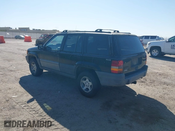 1997 Jeep Grand Cherokee Laredo with VIN 1J4GZ58S4VC633205, listed as a IAAI auction lot 41727571 with 201,228 mi miles. Bid and sale history available at carsss.com. Image 3.