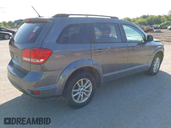 2013 Dodge Journey SXT with VIN 3C4PDDBGXDT607052, listed as a IAAI auction lot 42543102 with 157,325 mi miles and . Bid and sale history available at DreamBid. Image 4.