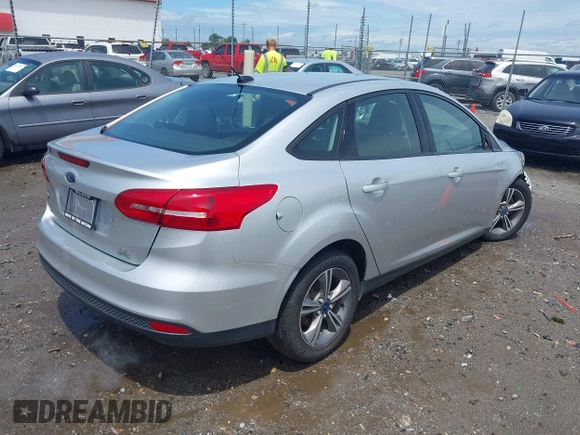 2017 Ford Focus SE with VIN 1FADP3FE4HL295573, listed as a IAAI auction lot 39562568 with 96,939 mi miles and . Bid and sale history available at carsss.com. Image 4.