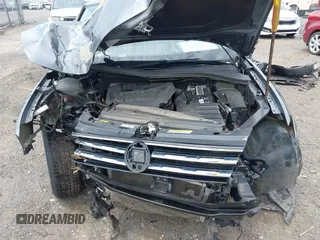 2021 Volkswagen Tiguan SE z VIN 3VV3B7AX8MM159316, wystawiony jako IAAI lot #42525546 z przebiegiem 70 141 mil mil oraz . Historia ofert i sprzedaży dostępna na DreamBid. Obrazek 10.