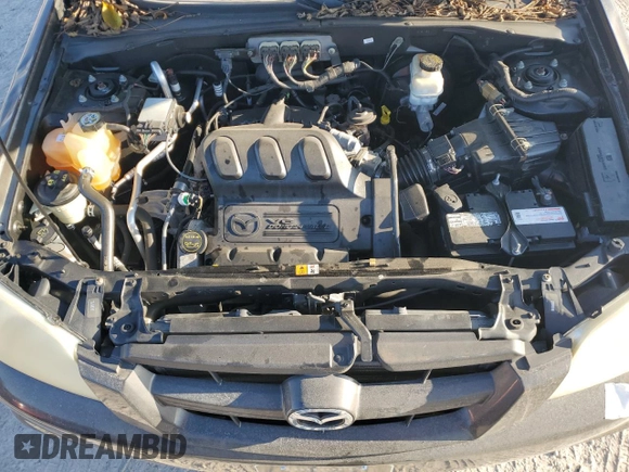 2006 Mazda Tribute S with VIN 4F2YZ04116KM23873, listed as a Copart auction lot 79926084 with 67,142 mi miles and Salvage Title. Bid and sale history available at DreamBid. Image 12.