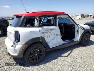 2013 MINI Countryman S ALL4 z VIN WMWZC5C56DWM16296, wystawiony jako Copart lot #56985615 z przebiegiem 63 858 mil mil oraz Szkoda całkowita • Salvage title. Historia ofert i sprzedaży dostępna na DreamBid. Obrazek 3.