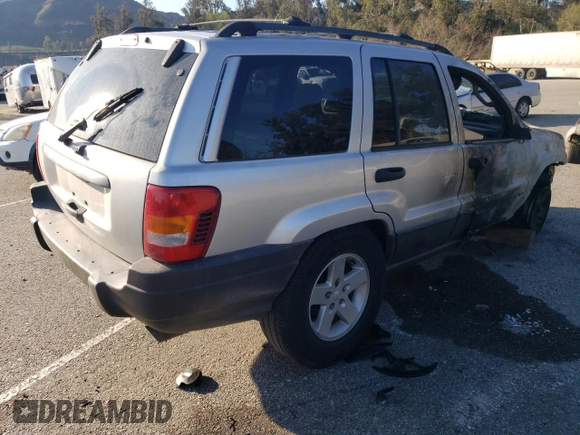2003 Jeep Grand Cherokee Laredo with VIN 1J4GX48S63C523513, listed as a Copart auction lot 50001005 with 0 mi miles and Salvage Title. Bid and sale history available at carsss.com. Image 3.