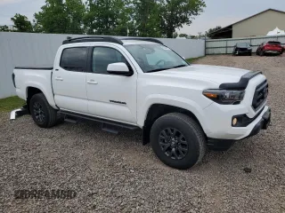 2023 Toyota Tacoma SR with VIN 3TMCZ5AN2PM642205, listed as a Copart auction lot 61045955 with 10,596 mi miles and Salvage title. Bid and sale history available at DreamBid. Image 4.
