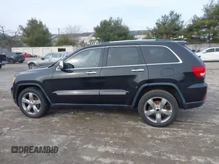 2013 Jeep Grand Cherokee Overland with VIN 1C4RJECG5DC621149, listed as a IAAI auction lot 41255140 with 157,355 mi miles. Bid and sale history available at carsss.com. Image 14.