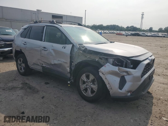 2023 Toyota RAV4 Hybrid XLE with VIN JTMRWRFV7PD166743, listed as a Copart auction lot 59964505 with 87,404 mi miles and Salvage title. Bid and sale history available at DreamBid. Image 4.