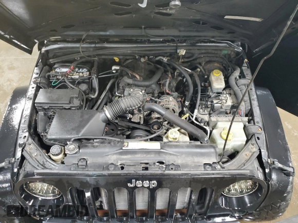 2008 Jeep Wrangler Unlimited X with VIN 1J4GA39158L610358, listed as a Copart auction lot 51274345 with 179,076 mi miles and Salvage Title. Bid and sale history available at DreamBid. Image 11.